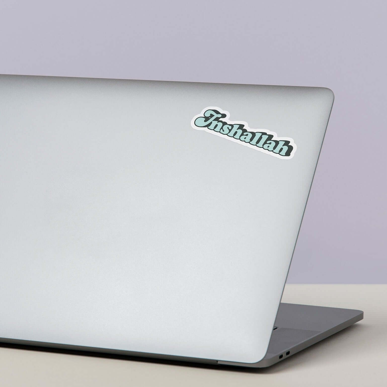 DRAMA Blue Inshallah Sticker on a laptop