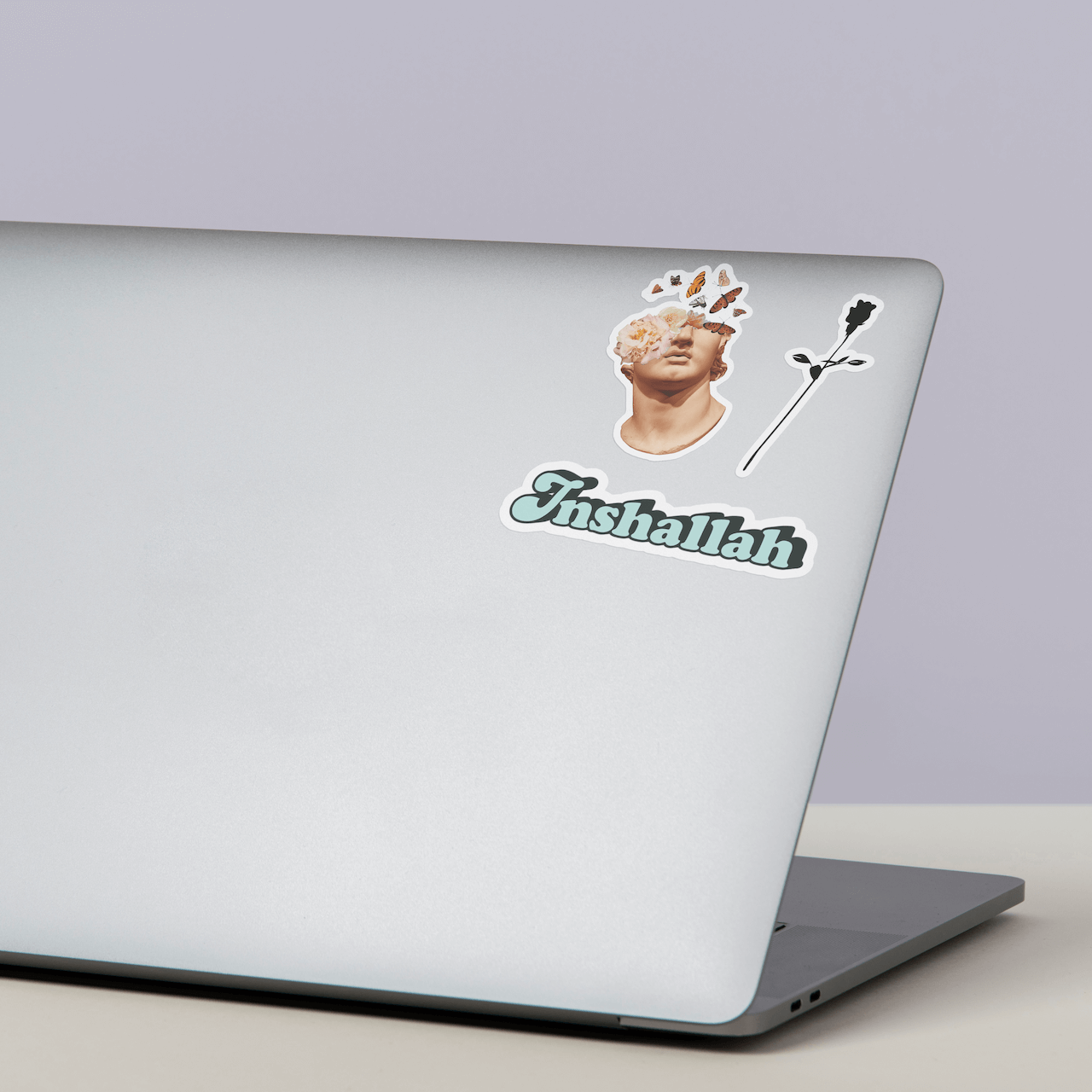 DRAMA Rose Logo Sticker on a laptop