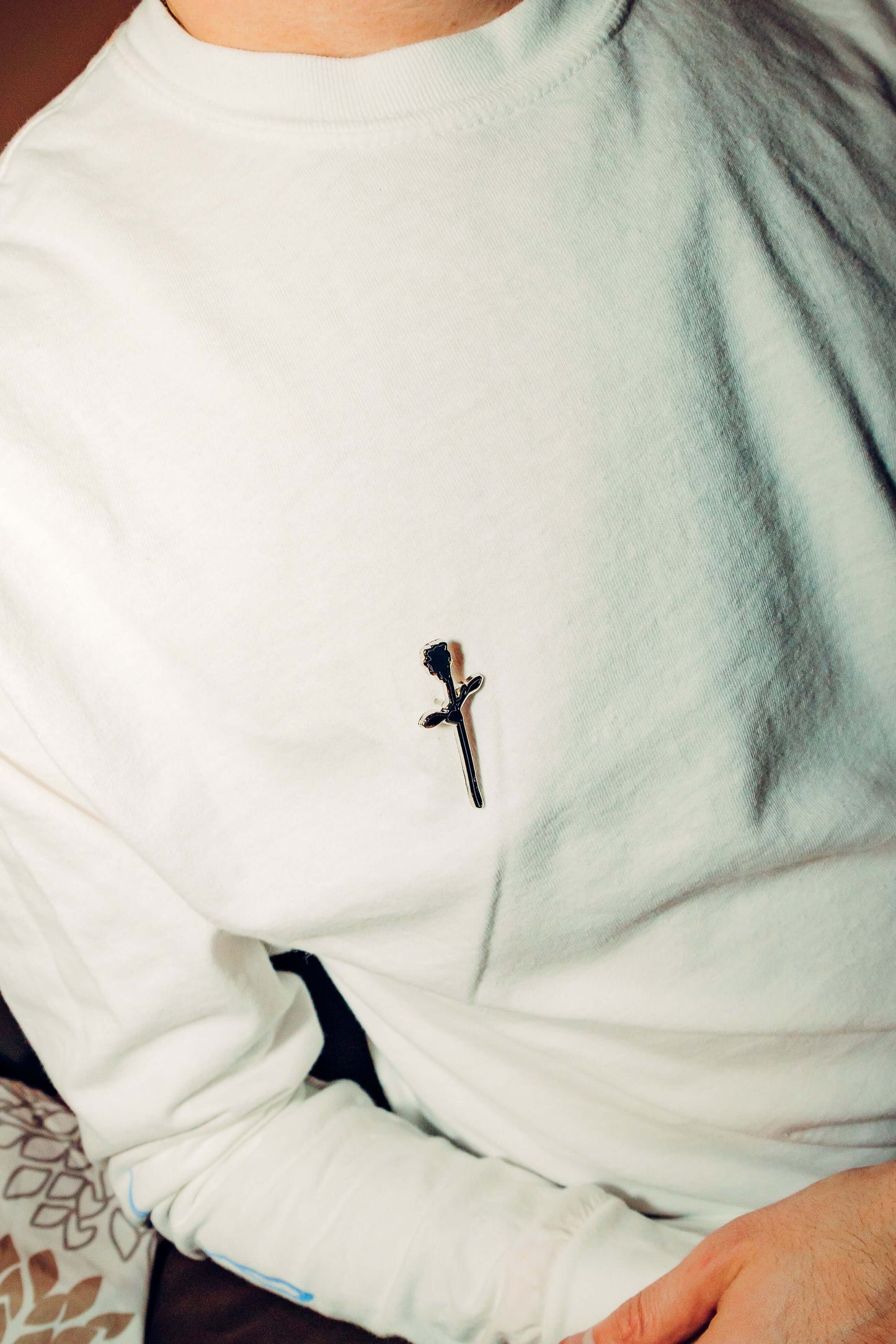 DRAMA Rose Pin on a shirt