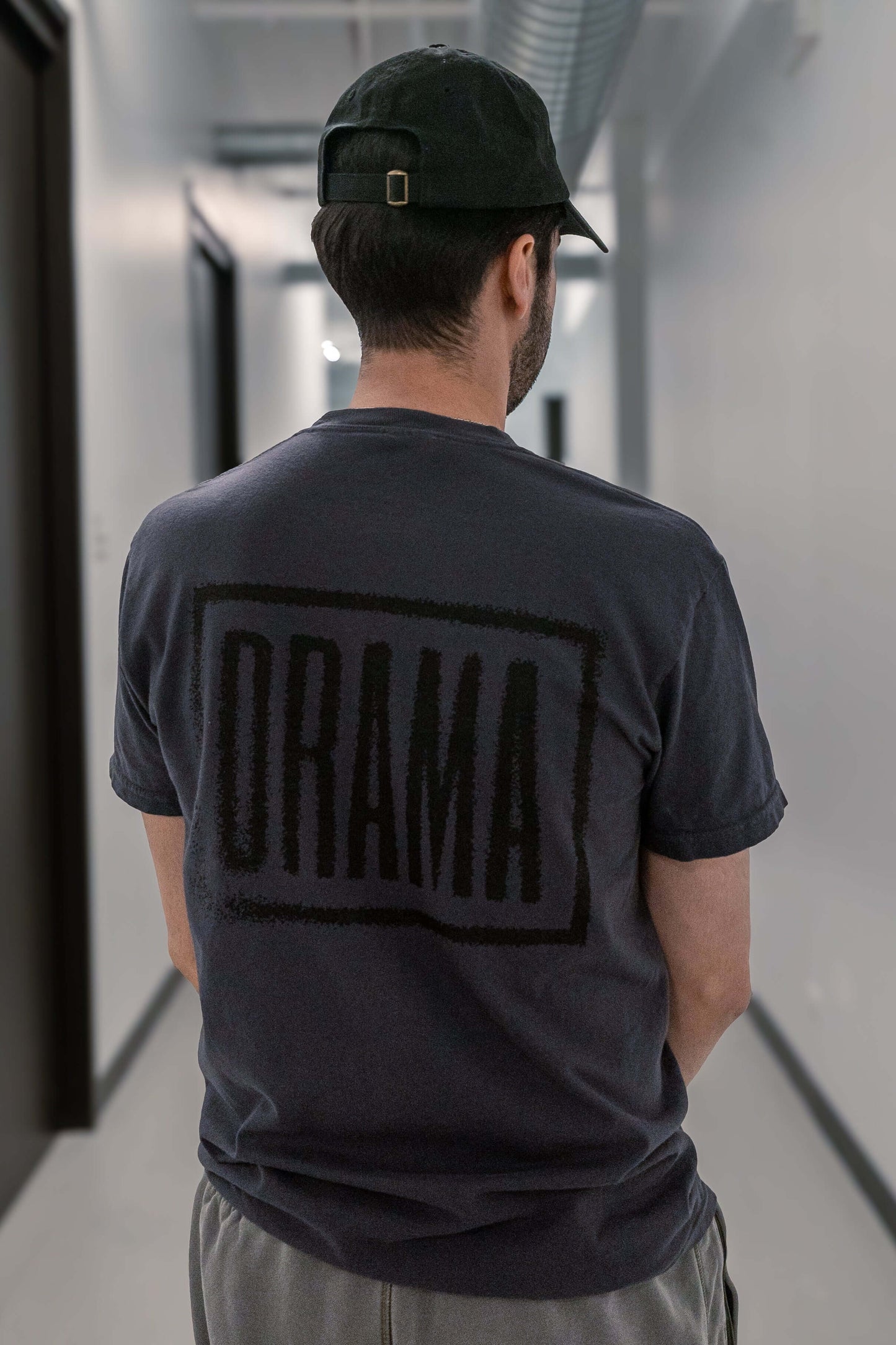 Nael wearing DRAMA Faded Rose Tee in Graphite