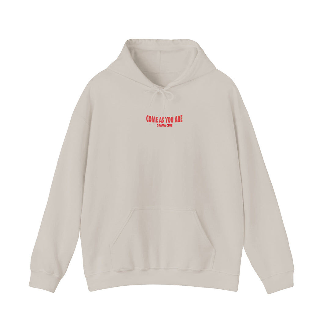 front of beige hoodie with come as you are printed in red on the front upper center chest
