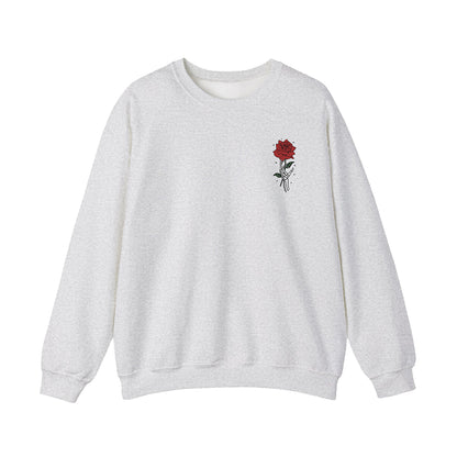 Light gray DRAMA Lovers Crewneck with a small red rose and hand illustration on the left chest.